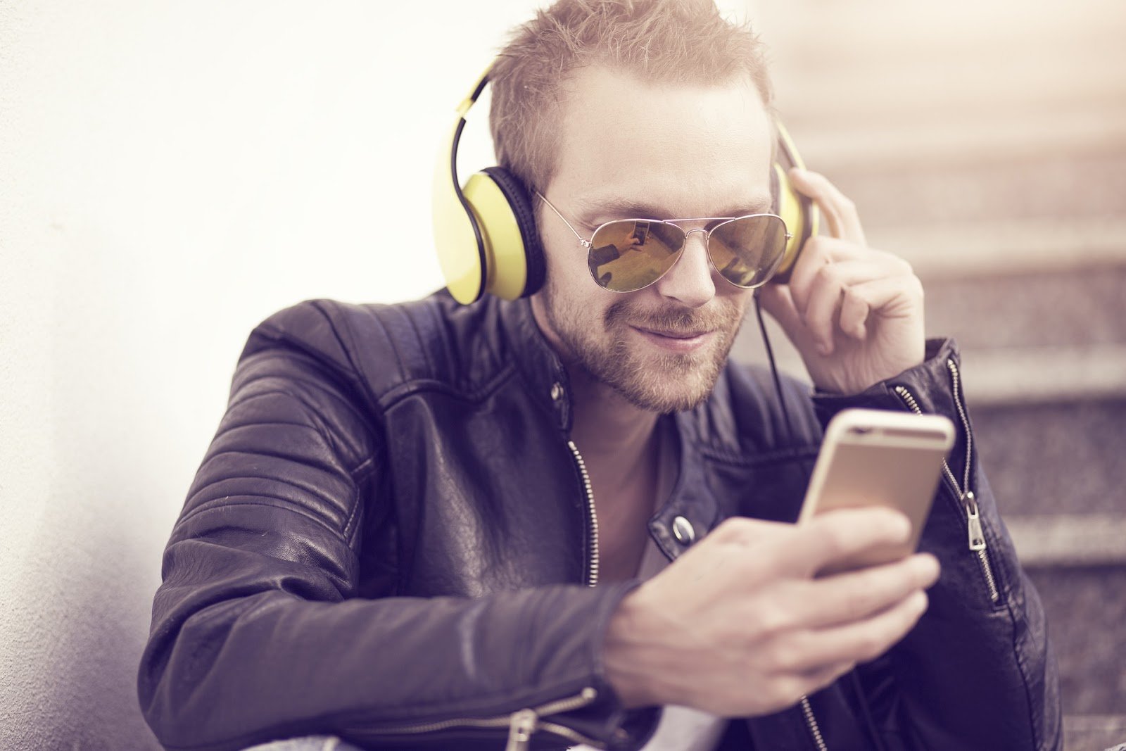 a Man with smartphone - how to increase podcast listeners