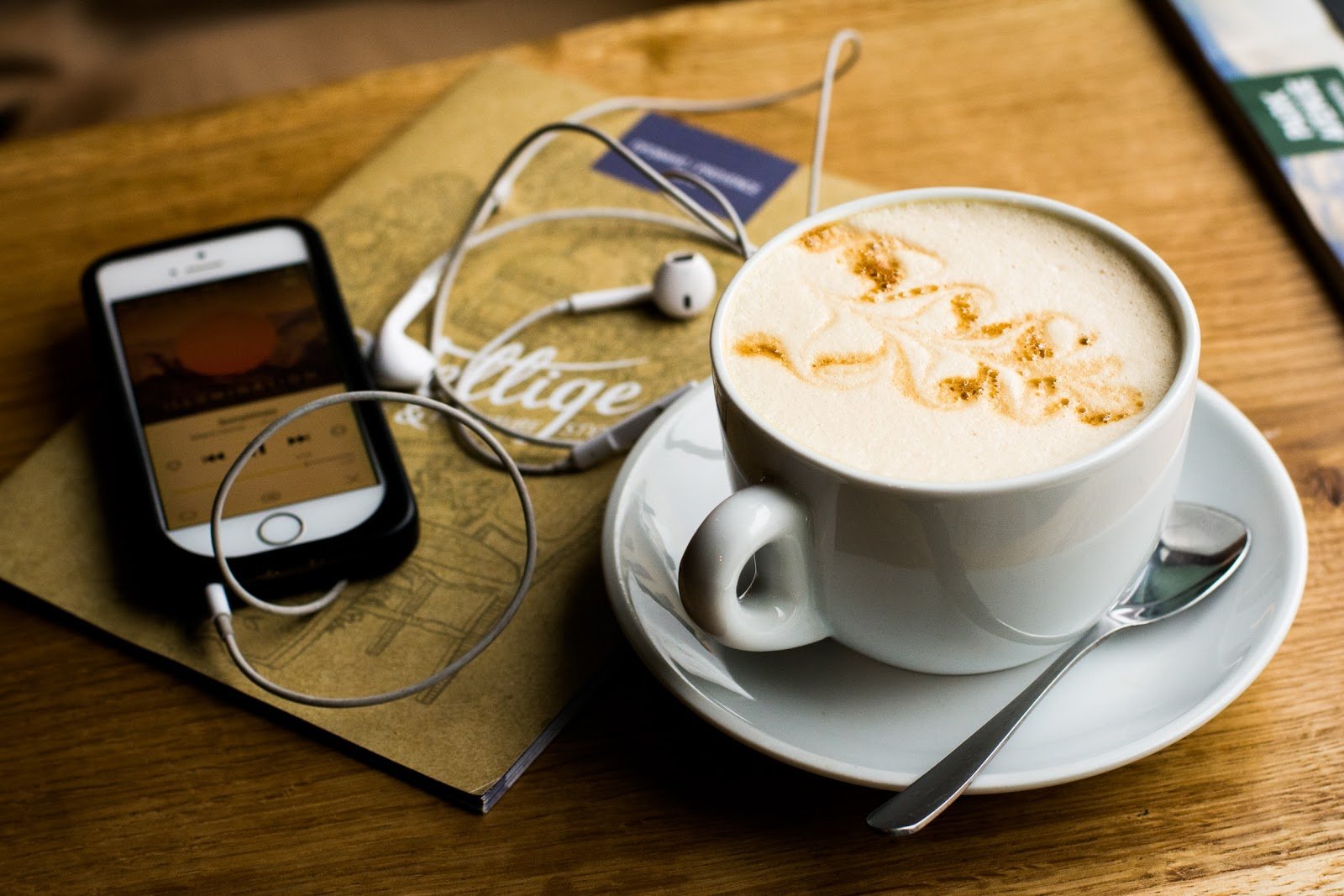 Preparing to using phone while drinking coffee